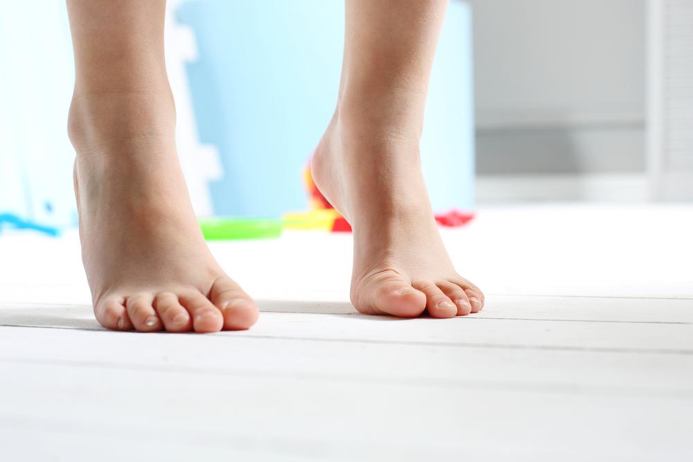 Bare feet on tile image