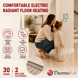 ThermoSoft electric radiant floor heating advertisement showing a woman and child interacting with a wall thermostat in a modern home, with product benefits icons and a circular inset of the heating element layout.